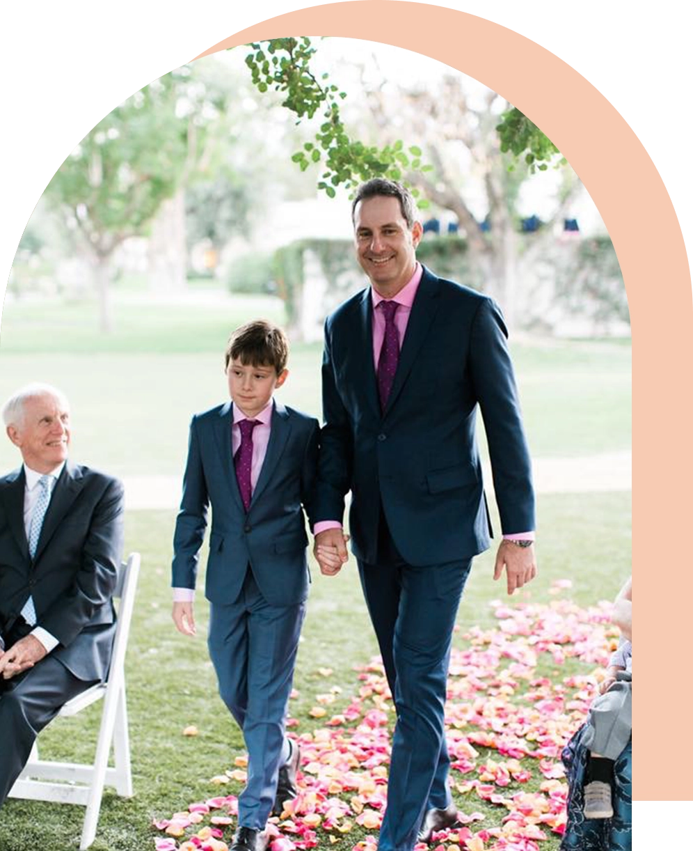 A man and boy walking down the aisle