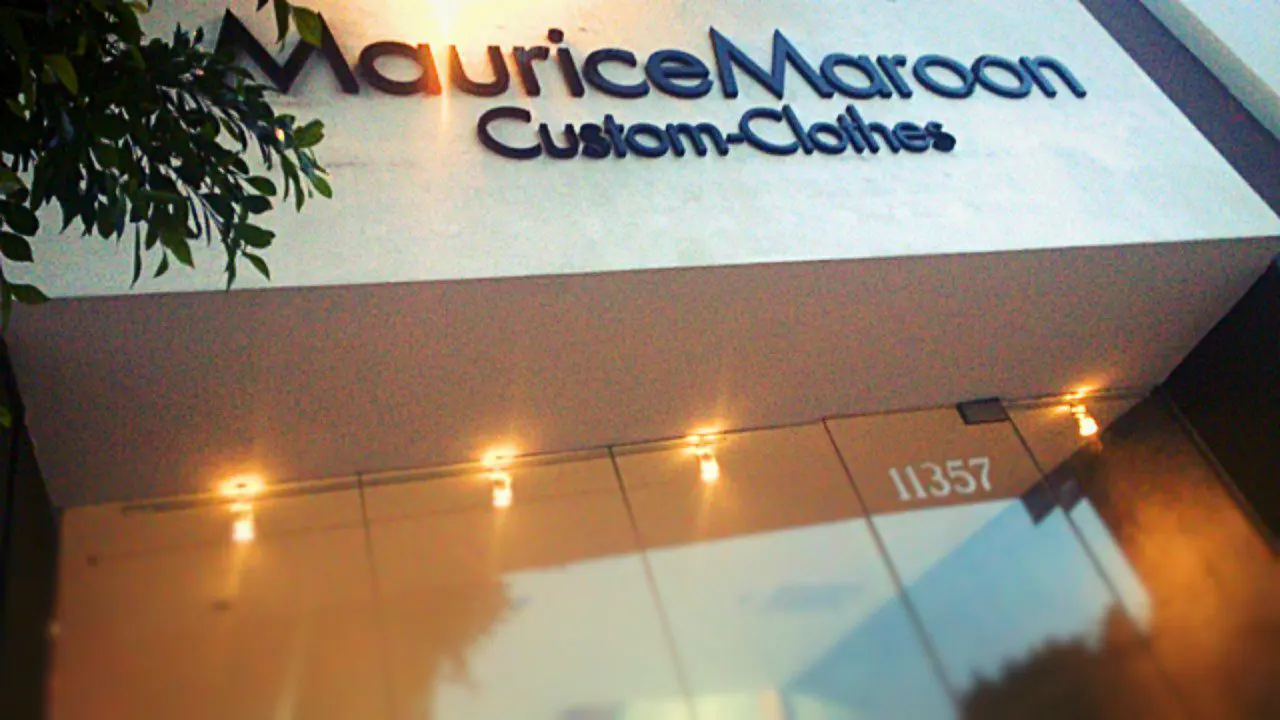 A sign for maurice marron custom clothes